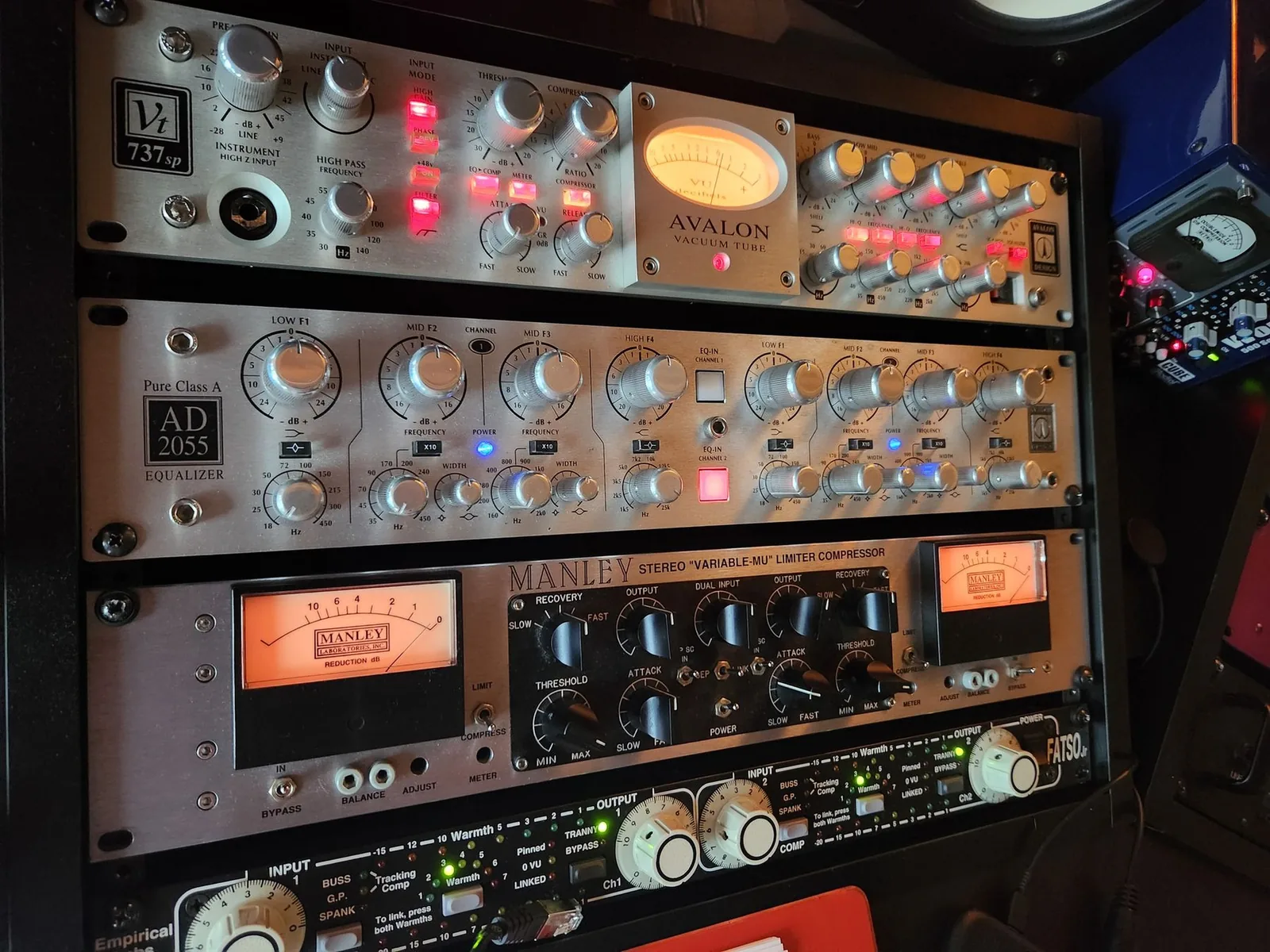 Photo of four rack-mounted units stacked top to bottom: an Avalon 737 channel strip, an Avalon AD2055 equalizer, a Manley Variable Mu compressor, and an Empirical Labs Fatso.